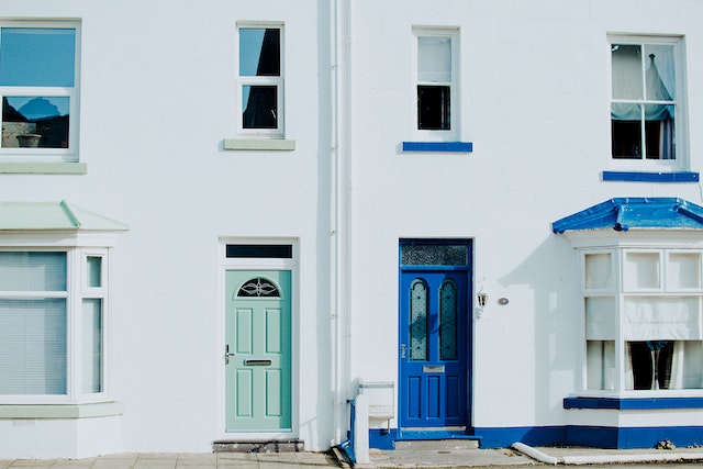 Two front doors - one mint green, one blue